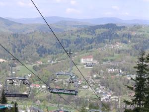 two gondolas on a ski lift in the mountains at LECH Home APARTAMENT NA GÓRZE in Wisła