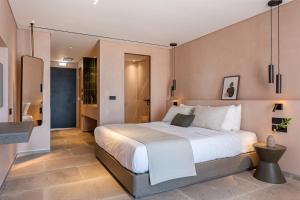 Postel nebo postele na pokoji v ubytování Tetra Resort & Spa Kefalonia