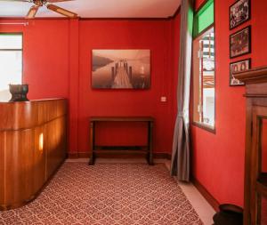 TV a/nebo společenská místnost v ubytování Le Jardin Hotel