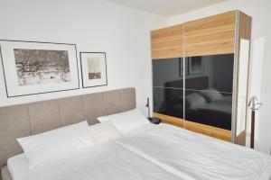 Voodi või voodid majutusasutuse NordseeResort Friesland NordseeResort Friesland 51-2-S toas