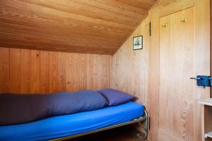 Krevet ili kreveti u jedinici u okviru objekta Unique Tiny house between Mnt Rigi and Lake Lucerne