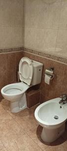 a bathroom with a toilet and a sink at Miramar Palace 612S in Sunny Beach