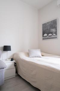 Katil atau katil-katil dalam bilik di Comfy Studio in Central Helsinki