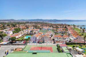 an aerial view of a city with tennis courts at Sol Guadalmar in Málaga