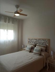Ένα ή περισσότερα κρεβάτια σε δωμάτιο στο Apartamento Denia Deveses