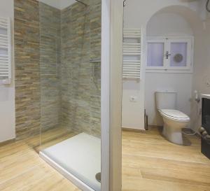 a bathroom with a toilet and a glass shower at Apartments Florence - Rosa piccolo in Florence