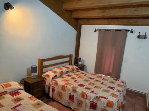 Postel nebo postele na pokoji v ubytování Casas Rurales el Cerrete de Haro + 37 fotografií