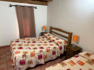 Postel nebo postele na pokoji v ubytování Casas Rurales el Cerrete de Haro