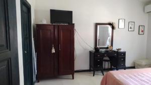 Ένα ή περισσότερα κρεβάτια σε δωμάτιο στο villas bahia +8 φωτογραφίες