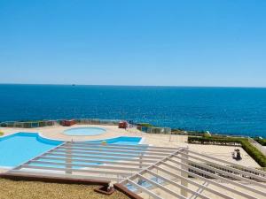 a swimming pool with the ocean in the background at ''578'' Superbe T2 Front de mer, Parking, Clim in Sète