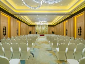 a conference room with rows of chairs and a chandelier at NOVOTEL Jinji Lake Suzhou SIP in Suzhou +157 photos