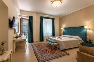 Postel nebo postele na pokoji v ubytování Hotel Parco delle Fontane