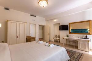 Postel nebo postele na pokoji v ubytování Hotel Parco delle Fontane