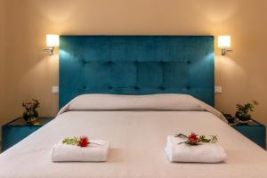 Postel nebo postele na pokoji v ubytování Hotel Parco delle Fontane