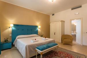 Postel nebo postele na pokoji v ubytování Hotel Parco delle Fontane