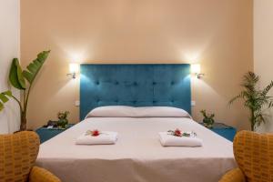 Postel nebo postele na pokoji v ubytování Hotel Parco delle Fontane