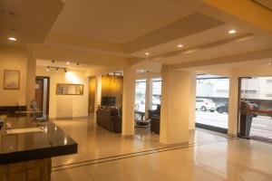 a lobby with a couch and a living room at HANNA Balneário Hotel in Balneário Camboriú