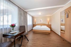 Postel nebo postele na pokoji v ubytování Hotel Ganslhof - Adults only