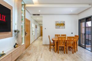 a dining room with a table and chairs at Madani Palazza Appart & Duplex in Marrakech