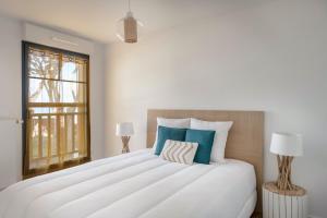 Ένα ή περισσότερα κρεβάτια σε δωμάτιο στο Bel appartement pour 4 face mer