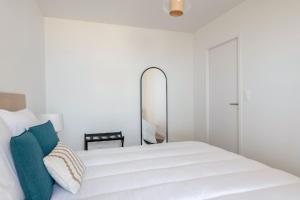 Ένα ή περισσότερα κρεβάτια σε δωμάτιο στο Bel appartement pour 4 face mer