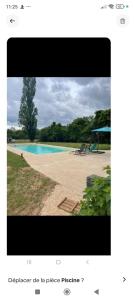 a screenshot of a picture of a swimming pool at L'étang du griffolet 3 in Ussac
