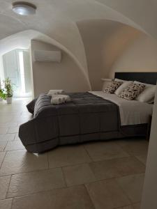 Letto o letti in una camera di Terra D`Itria