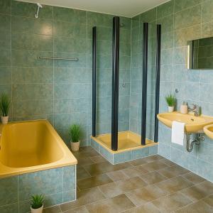 a bathroom with a tub and a sink at SUNNYHOME Monteurwohnungen und Apartments in Schwandorf in Schwandorf in Bayern
