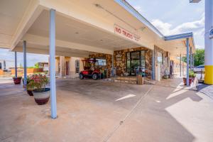 a building with a no parking sign in a parking lot at Purple Sage By OYO Snyder TX in Snyder