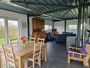 Posezení v ubytování L'Harmonie du Jardin Gîte