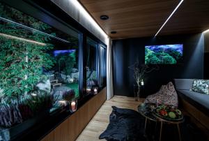 an aquarium in the living room of a house at Zoška Park Eden in Modra