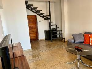 a living room with a couch and a glass table at Podaca Holiday House with Sea View in Podaca +9 photos