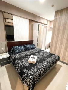 Voodi või voodid majutusasutuse PakuwonMall Apartment Anderson 2BR by B&B Host toas +17 fotot