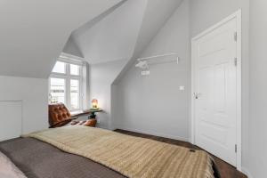 Postelja oz. postelje v sobi nastanitve 2BR Apartment in the Heart of Selfoss