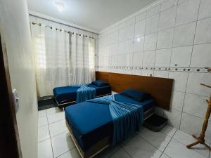 Postel nebo postele na pokoji v ubytování Cascais Quartos & Suítes