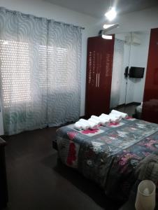 A bed or beds in a room at La Pinetina Roma