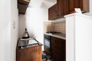Kuchyň nebo kuchyňský kout v ubytování Appartamento Pineta Mare