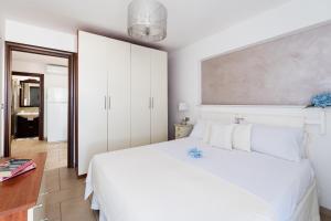 Postel nebo postele na pokoji v ubytování Appartamento Pineta Mare