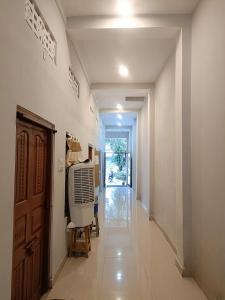 a hallway with a room with a heater in it at Shanker Bhawan Homestay in Gaya