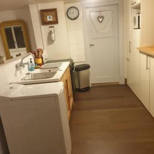 a kitchen with a sink and a counter top at Maison spacieuse à Sainte-Croix-en-Plaine avec jardin in Sainte-Croix-en-Plaine +29 photos
