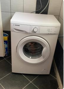 a white washer and dryer in a bathroom at Sunny in Split