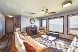a living room with a couch and a table at BBQ Ready Lakefront Retreat in Watertown in Watertown