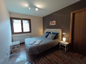 Ένα ή περισσότερα κρεβάτια σε δωμάτιο στο InmoCyma Mincholet bajo con terraza