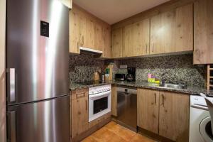 Η κουζίνα ή μικρή κουζίνα στο InmoCyma Mincholet bajo con terraza +27 φωτογραφίες