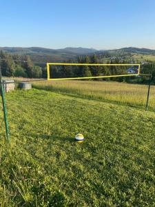 a frisbee on the grass in a soccer field at Chata Drevenica Orava in Oravská Lesná +30 photos