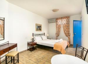 A bed or beds in a room at Livanios Studios