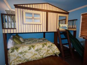 a bedroom with a bunk bed and a ladder at F-30 Small World in Anaheim +42 photos