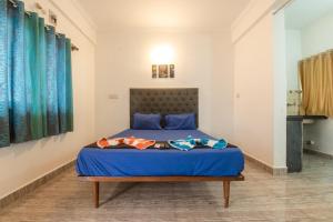 Ένα ή περισσότερα κρεβάτια σε δωμάτιο στο Hotel Rohit Holiday Homes