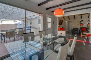 a dining room and living room with a glass table at F-24 Mickeys House in Anaheim