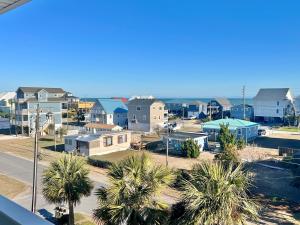 a view of a suburb with palm trees and houses at Ocean View Condo in Surf City - Sea Coast Suites 25 in Surf City